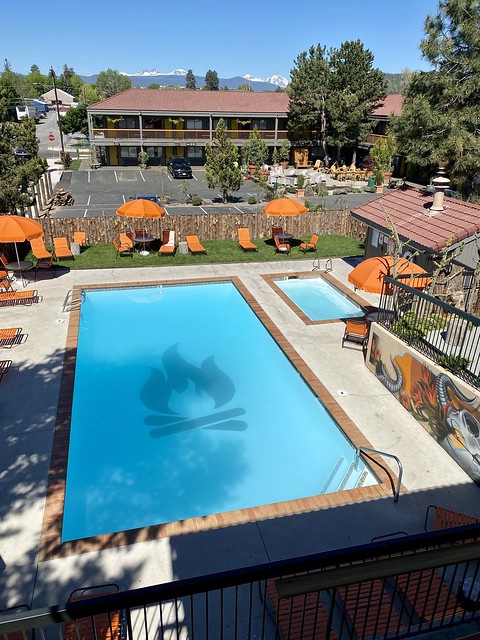 The outdoor swimming pool at Campfire Hotel in Bend has the campfire logo at the bottom of the pool. See view of Three Sisters from our hotel room. 