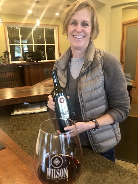 Winemaker Diane Wilson holds a bottle of Wilson Winery Zinfandel at her winery in Healdsburg, California. 