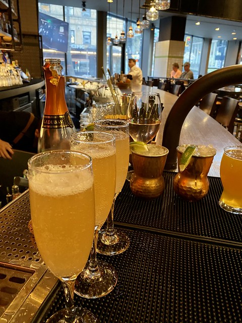 Sparkling wine and craft cocktails, include Moscow Mules at Outlier restaurant bar inside Kimpton Hotel Monaco Seattle. 