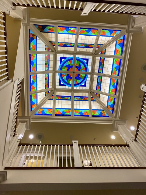 The stained-glass window as seen from the fourth floor of the Majestic Inn & Spa. Brilliantly colored blue, red and green glass, form a pattern on the Majestic hotel skylight in downtown Anacortes, Washington