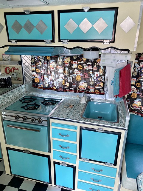 Inside the retro vintage trailer at Retro Inn Mesa Verde in Cortez, Colorado. The baby blue interior, kitchen stove and drawers bring me back to the 1960's. Cute themed trailer parked at the motel. 